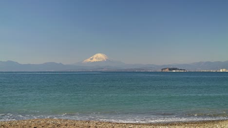 Calm-view-of-Mount-Fuji-and-Enoshima-island-with-ocean-from-calm-beach
