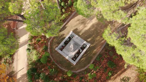 Aerial-rising-shot-of-Cambacares-Castle-Park-with-a-monument-in-France