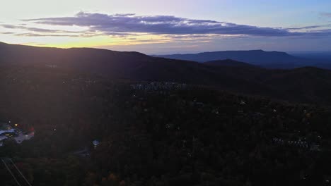 Slow-Fly-Over-the-Smoky-Mountains-and-Pigeon-Forge,-TN-at-Sunset-in-the-Fall