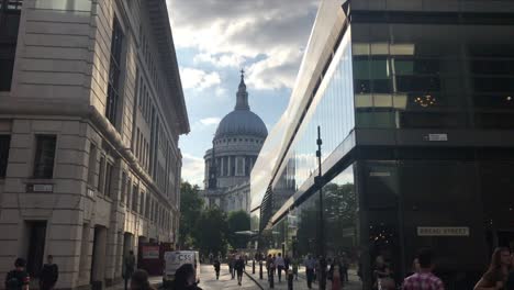 View-between-buildings-looking-up-at-St-Paul's-Cathedral-in-London,-U