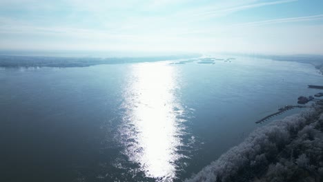 Sunlit-Waters-of-Danube-River-In-The-Early-Morning-In-Winter-In-Galati,-Romania
