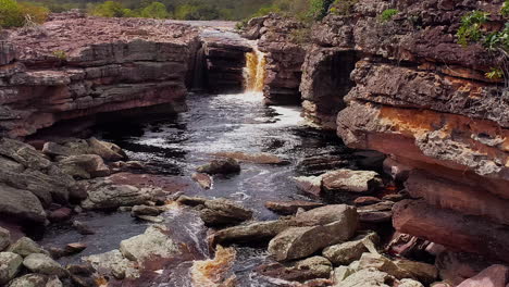 Aerial-view-of-a-waterfall-in-the-middle-of-a-vegetation,-Chapada-Diamantina,-Bahia,-Brazil