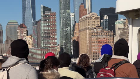 Downtown-Manhattan-Skyscrapers,-in-NYC,-Seen-from-Seats-of-Ferry