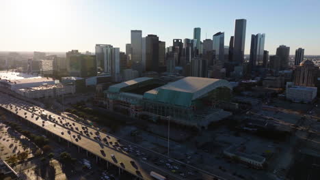 Drone-shot-away-from-the-Minute-maid-park,-sunny-evening-in-Houston,-USA