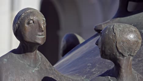 Bronze-statues-of-the-Lebensbrunnen-fountain-by-the-artist-Martin-Rainer-in-Brixen---Bressanone,-South-Tyrol,-Italy