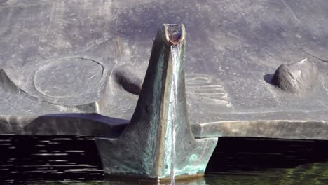 Faucet-of-the-Lebensbrunnen-fountain-by-the-artist-Martin-Rainer-on-the-Domplatz-square-in-Brixen---Bressanone,-South-Tyrol,-Italy