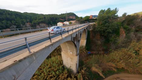 Chasing-a-sports-car-over-a-bridge-in-Spain
