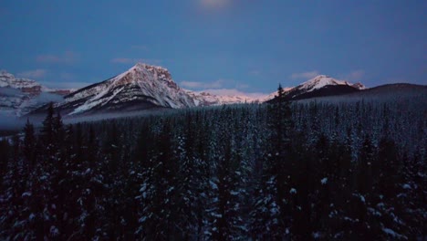 Drone-view-of-the-snowy-mountains-of-Banff-Canada-in-winter