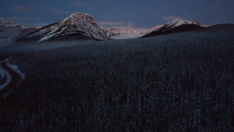 Drone-view-of-the-snowy-mountains-of-Banff-Canada-in-winter