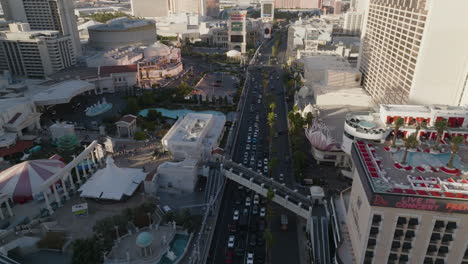 Aerial-view-diving-over-the-strip,-Las-Vegas-Boulevard,-sunny-morning-in-USA