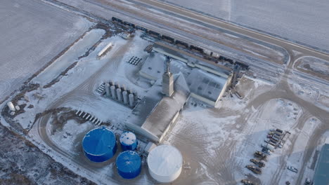 Aerial-View-of-Snow-Covered-Fertilizer-Plant-in-Winter
