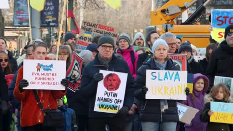 People-in-Sweden-with-signs-and-flags-protest-Russian-war-in-Ukraine