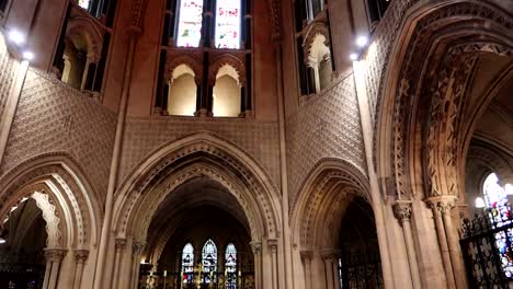 Panning-shot-of-interior-of-Christ-Church-with-arches-and-windows-in-Dublin