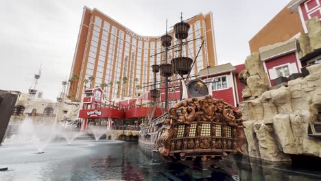 Wide-exterior-shot-of-water-fountains-and-ship-in-front-of-Treasure-Island-Hotel-and-Casino