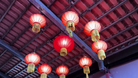 Charming-Red-Lanterns-Decorating-a-Traditional-Singapore-Building-Low-Angle-Shot