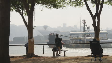 Residents'-activities-on-the-riverbank-in-the-pedestrian-area,-Hong-Kong,-China