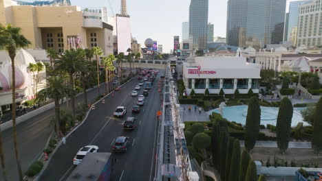 Drone-shot-flying-over-the-F1-light-fence-on-the-strip,-sunrise-in-Las-Vegas,-USA