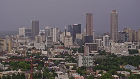 Atlanta-Georgia-Aerial-v911-zoomed-shot,-flyover-O4W-and-Sweet-Auburn-capturing-cityscape-of-downtown-and-intown-neighborhoods-and-Husley-Yard-on-a-stormy-day---Shot-with-Mavic-3-Pro-Cine---May-2023