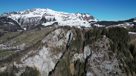 Amden-Weesen-Switzerland-aerial-towards-cliff-above-the-valley-town