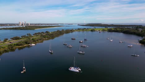 Forward-moving-aerial-views-over-the-Broadwater-and-The-Spit-with-boats-on-anchor,-Gold-Coast,-Australia