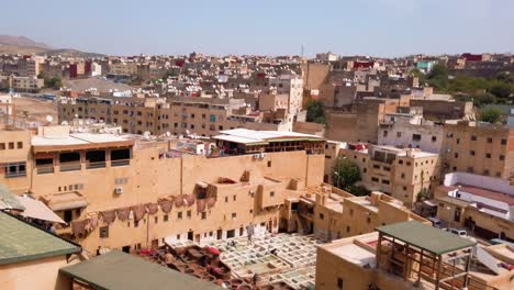 Morocco,-Fes-cityscape-and-the-Chouara-Tannery-from-distance-surrounded-by-the-old-city-and-market