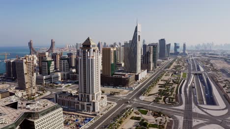 Lusail-marina-in-qatar-showcasing-construction-and-city-skyline,-aerial-view