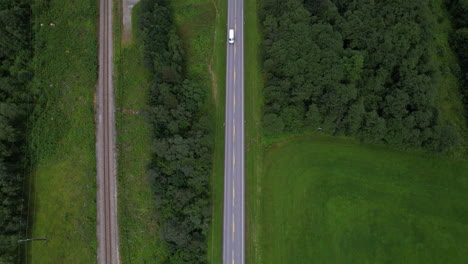 Countryside-Road-Through-Green-Lands-Towards-Andalsnes-Region-In-Norway,-Aerial-Top-Down-View