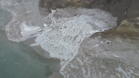 Klöntalersee-Glarus-Switzerland-iced-over-water-that-flows-to-the-lake