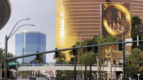 Shot-of-the-pedestrian-bridge-crossing-Las-Vegas-Blvd-with-Wynn-and-Fountainbleu-resorts-in-background