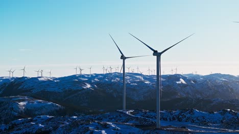 A-View-Of-Bessaker-Wind-Farm-On-Winter-Mountains-In-Norway