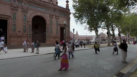 Tourists-Walking-at-Plaza-de-España-in-Seville