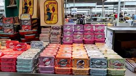 Iconic-colorful-sardine-cans-for-sale-in-Market-of-Bolhao,-Porto,-Portugal