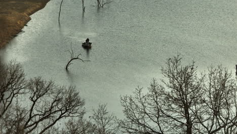 Isolated-View-Of-A-Fisherman-At-Lake-Swepco-In-Arkansas,-United-States