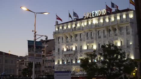 The-Splendid-Luxury-Hotel-near-the-main-square-at-dusk,-Handheld-wide-shot