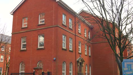 Tilt-up-shot-of-Consulate-General-of-the-Republic-of-Turkiye-Manchester-building-located-near-oxford-road,-Manchester,-England-on-a-cloudy-day