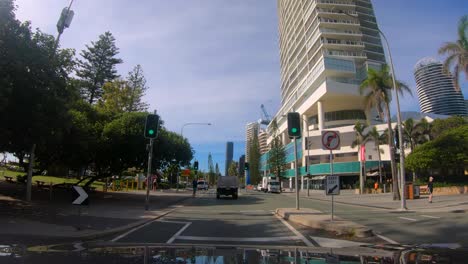Point-of-view-driving-through-Broadbeach-on-Old-Burleigh-Road,-Gold-Coast,-Australia