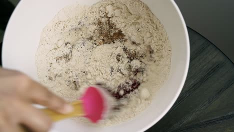 Mixing-flour-and-chocolate-beet-batter-to-make-muffins-on-valentine's-day-dessert