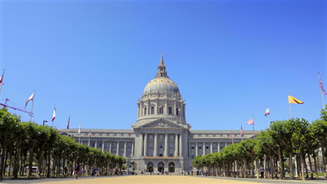 Flags-Waving-at-the-Civic-Center-Plaza-in-San-Francisco-City-Hall,-California-Aerial-Pan-Down-Shot