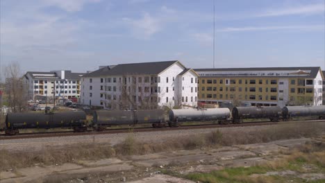 Drone-view-of-new-housing-construction-as-train-passes-by