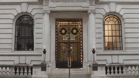 Tilt-down-shot-of-facade-of-Institution-of-Civil-Engineers-building-at-one-great-George-Street,-Westminster,-London,-UK