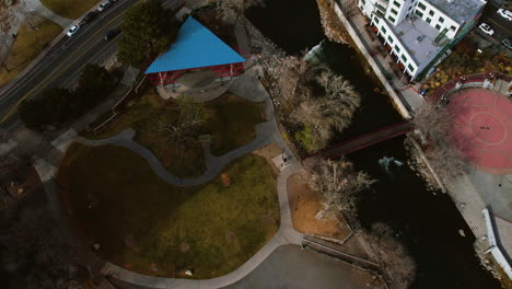 Birdseye-Aerial-View-of-Wingfield-Park-and-Truckee-River-in-Reno,-Nevada-USA