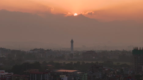 Beautiful-sunset-in-Kathmandu-Nepal-Drone-shot-revealing-Dharahara-Tower-and-landscape-of-unmanaged-Urban-City