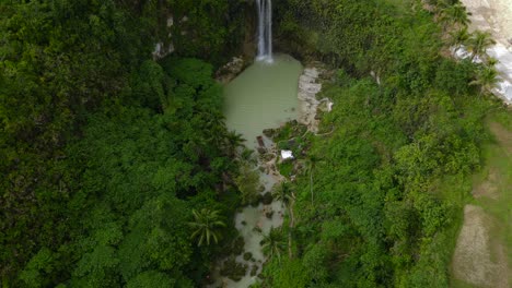 Camugao-falls-surrounded-by-lush-greenery-in-the-philippines,-tranquil-nature-scene,-aerial-view