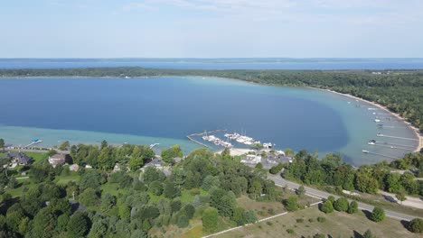 Bowers-Harbor,-Old-Mission-Peninsula,-Michigan,-USA---residential-homes-and-docks-for-boats