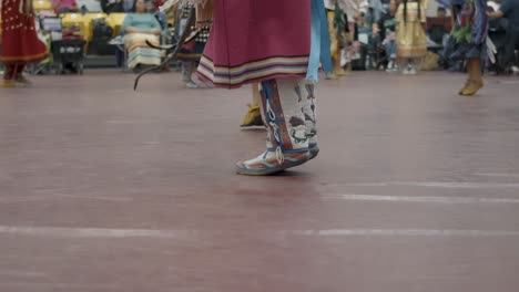 The-mesmerizing-rhythms-of-Native-American-Powwow-dancing-at-Haskell-Indian-Nations-University's-Spring-semester-celebration-in-Lawrence,-Kansas