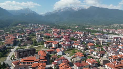 Bansko-Ski-Village-Resort-and-Pirin-Mountains-at-Summer-in-Bulgaria---Aerial-4k