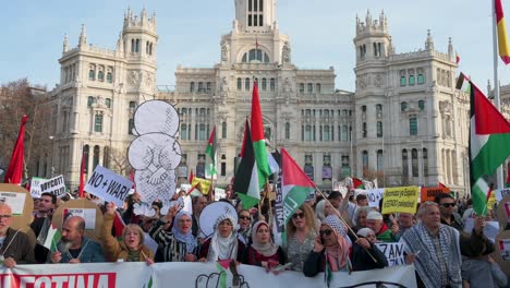 Protesters-rally-and-shout-slogans-during-a-march-in-solidarity-for-Palestine-in-front-of-Madrid's-Bank-of-Spain-building-demanding-the-war-in-Gaza-to-stop