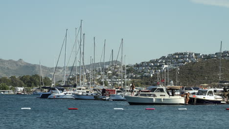 Boats-At-The-Marina-In-The-Ocean-On-A-Sunny-Day-In-Gumusluk,-Turkey