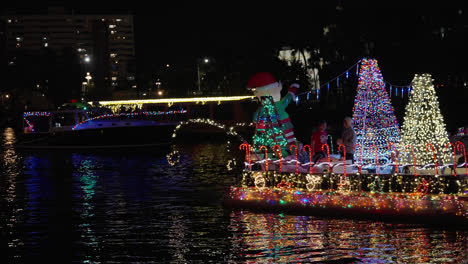 Beautiful-Holiday-Lights-Flashing-on-Boats-at-Christmas-Boat-Parade-in-Tampa,-Florida