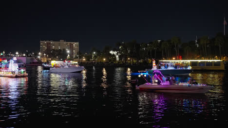 Christmas-Boat-Parade-on-Water-Channel-in-Tampa,-Florida